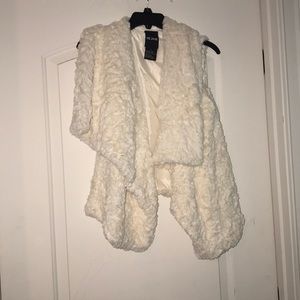 A white faux fur vest